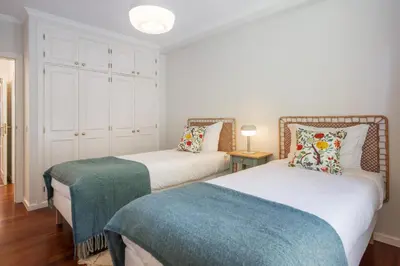 a bedroom with two beds at White House I Apartment with Garden View in Funchal