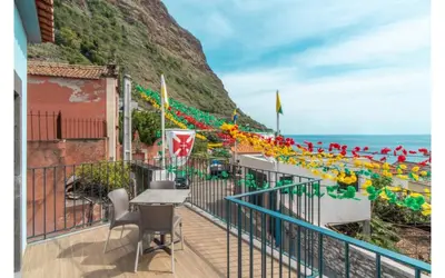 a view of a town with the ocean in the background at Casa AZUL Apartments in Jardim do Mar