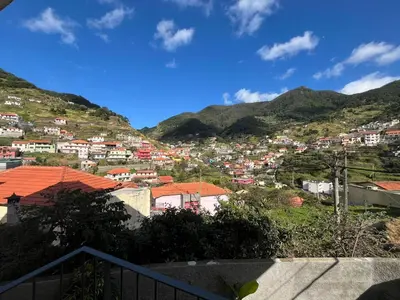 a view of a town on a mountain at Cozy Noia in Machico