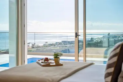 a living room with a view of the ocean at Half Gate Villa in Gaula