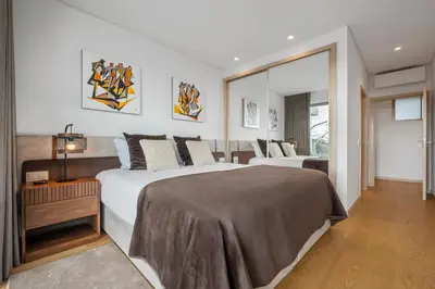a hotel room with two beds and a window at Half Gate Villa in Gaula