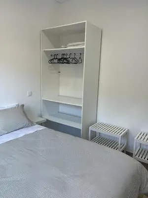 a shower stall in a bathroom with a toilet at Cozy Noia in Machico