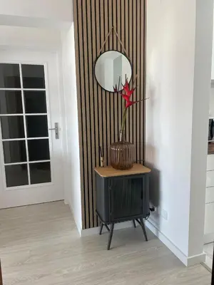a room with a vase with a flower on a table at Casa Lobos in Câmara de Lobos