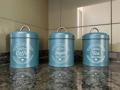 a group of three blue insulated buckets sitting on a counter at Forum Madeira pokoje in Funchal