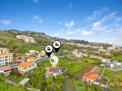 an aerial view of a city with black and white signs at Caniço Seaview House in Caniço