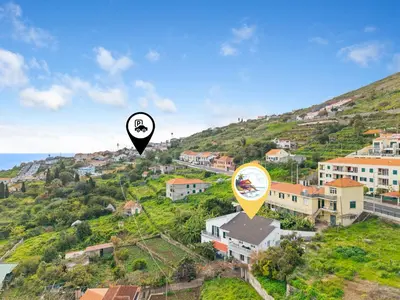 an image of a house on a hill with a map at Caniço Seaview House in Caniço