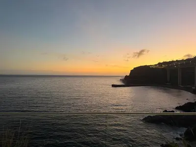 a view of the ocean at sunset at Luna do Mar - Luxury apt with Jacuzzi in Gaula
