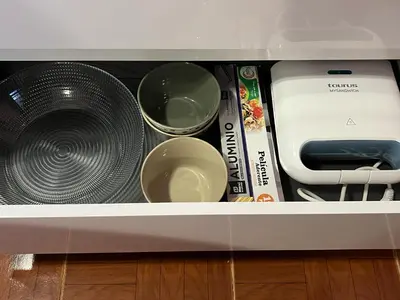 a drawer with a fan and other appliances in a kitchen at Casa Levada Explorer - Cozy Nights & Easy Meals in Santana