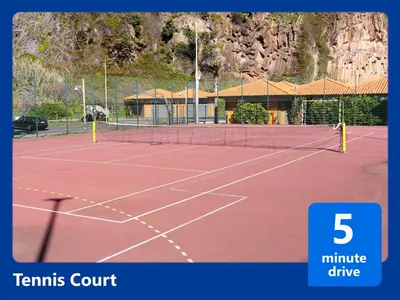a tennis court with five tennis courts at Casa Levada Explorer - Cozy Nights & Easy Meals in Santana