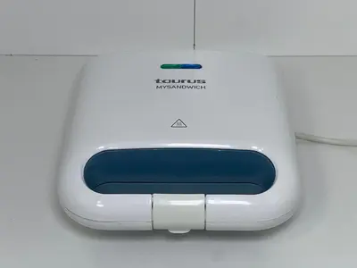 a white and blue router sitting on a table at Casa Levada Explorer - Cozy Nights & Easy Meals in Santana