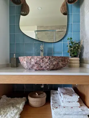 a bathroom with a sink and a mirror at Romantic Escape - Private jacuzzi and WOW seaview in Lagos