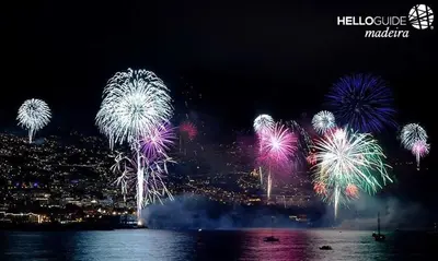 a bunch of fireworks in the sky over the water at Madeira Sun in Funchal