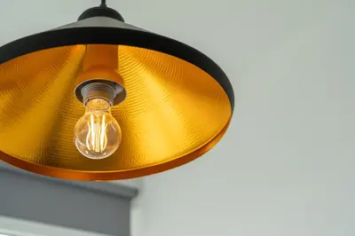 a light bulb hanging from a ceiling at Ocean View Apartment near Arrifana Beach with Parking in Aljezur