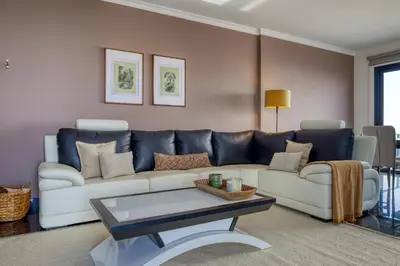 a living room with a couch and a coffee table at Oasis do Sol, a Home in Madeira in Ponta do Sol