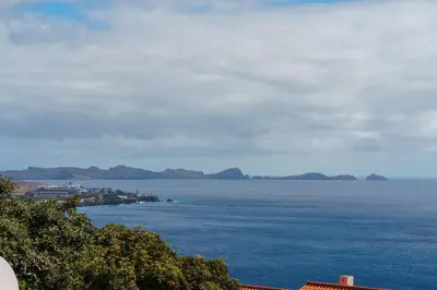 a view of the ocean with mountains in the distance at GuestReady - Alluring island retreat in Santa Cruz