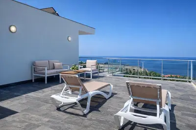 a house with a swimming pool in front of a house at Villa O Pomar with optional heated pool in Paul do Mar