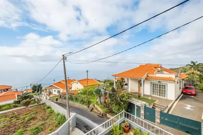 a view of a house from a balcony at Casa Avô ladeira 2 in Estreito da Calheta