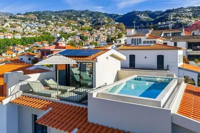 a view from the roof of a house with a swimming pool at Casa Modelo in Funchal