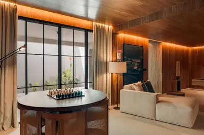 a living room with a table and a couch at Casa Modelo in Funchal