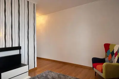 a living room with a couch and a chair at Villa Vieira Ocean View in Gaula