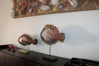 two pieces of art on top of a desk at Apartment Villa Sol II in Ponta do Sol