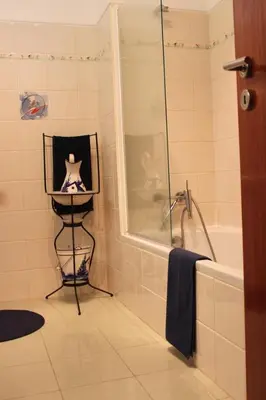 a bathroom with a shower and a sink and a bath tub at Apartment Villa Sol II in Ponta do Sol