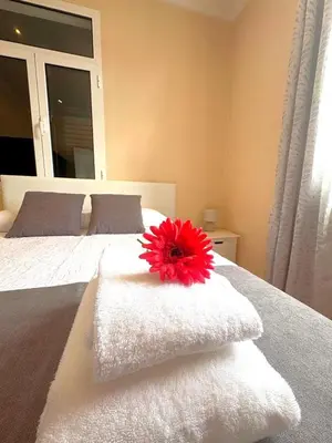 a bedroom with a bed with towels on it at Recanto da Maria, by Specialstays in Funchal
