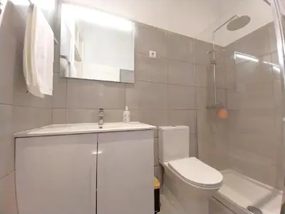 a bathroom with a toilet and a sink and a tub at Recanto da Maria, by Specialstays in Funchal