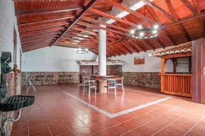 an empty room with a large glass door and a tile floor at Villa Teresinha in Relógio do Poiso