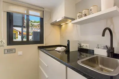 a kitchen with a sink and a counter top at Idalina's Place Funchal in Funchal
