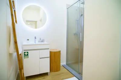a bathroom with a sink and a shower at Machim by SALIM in Machico