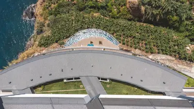 an overhead view of a building next to the ocean at Big Cliff - Ocean View by AH in Câmara de Lobos