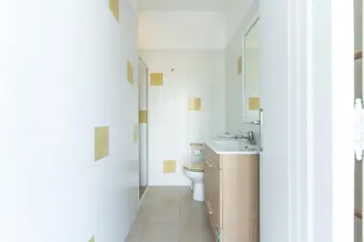 a bathroom with a toilet and a sink at Pitanga Apartment by AH in Câmara de Lobos