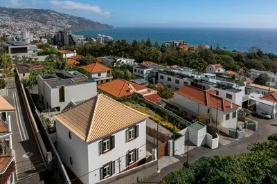 an aerial view of a city with houses at Traditional House Cozy 3-bedroom house in Funchal