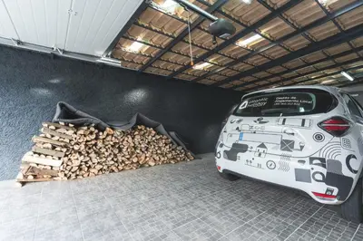 a car parked in a garage with a pile of wood at Villa Sofia by Atlantic Holiday in Machico