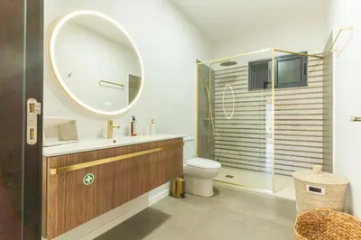 a bathroom with a sink and a toilet and a mirror at Villa Sofia by Atlantic Holiday in Machico