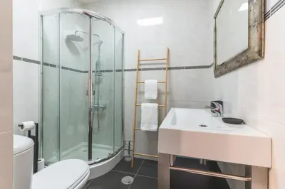a bathroom with a shower and a sink and a toilet at Richelieu Apartment by Atlantic Holiday in Água de Pena