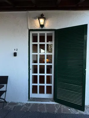 a door with a window and a light above it at Habitación con Cocina en la Montaña in Funchal