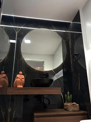 a bathroom with a sink and a mirror at Luxury Apartament NEXT to SAVOY in Funchal