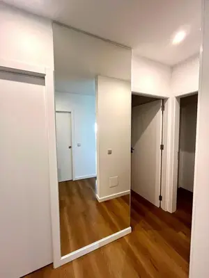 an empty apartment with a mirror in a room at Luxury Apartament NEXT to SAVOY in Funchal