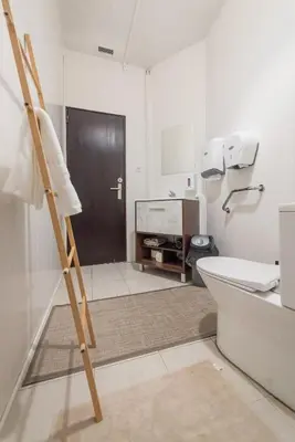 a bathroom with a toilet and a ladder in it at Abrigo dos Prazeres Guesthouse by Mth in Prazeres
