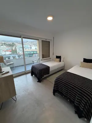 a bedroom with a large bed in a room at Infante Home I in Funchal