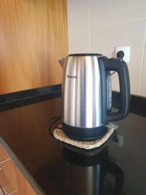 a kettle sitting on top of a stove at Farol Golfe in Ponta do Pargo