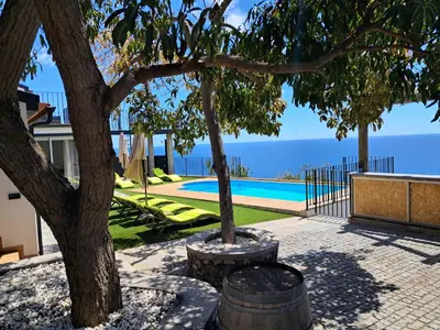 a swimming pool with a view of the ocean at Villa Falésia Atlântica II in Ribeira Brava