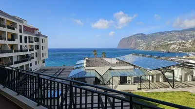 a balcony of a building with a view of the ocean at Formosa View in Funchal