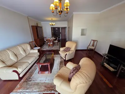 a kitchen with a table and a stainless steel refrigerator at Formosa View in Funchal