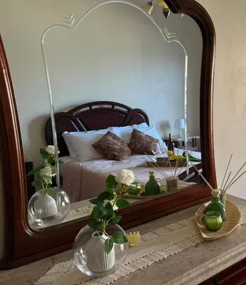 a bedroom with a bed with a large mirror at Formosa View in Funchal