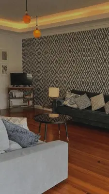 a living room with a couch and a table at House Pilar close to Funchal in Funchal