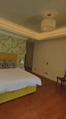 a bedroom with a bed and a chair in it at House Pilar close to Funchal in Funchal