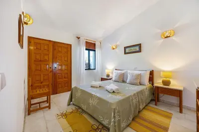 a bedroom with a bed with two towels on it at Casa 54 in Valverde